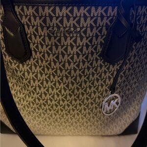 Black grey and white Michael Kors Bag .